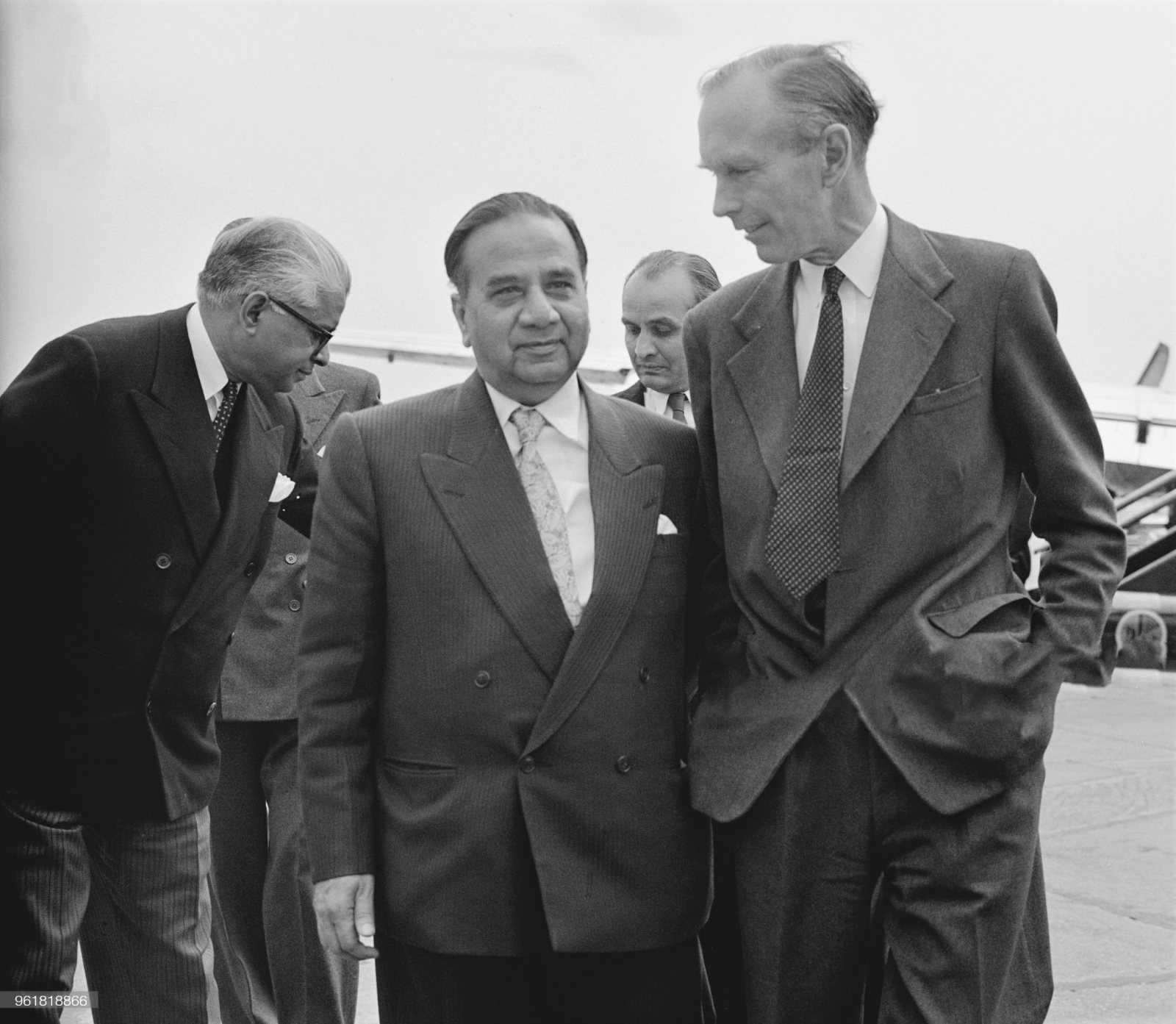 Huseyn Shaheed Suhrawardy (1892 - 1963), the Prime Minister of Pakistan, is met by Alec Douglas-Home (1903 - 1995, right), the Secretary of State for Commonwealth Relations, upon his arrival at London Airport, 24th June 1957. Suhrawardy is in the UK to attend the Commonwealth Prime Ministers' Conference which opens the next day, 24th June 1957.