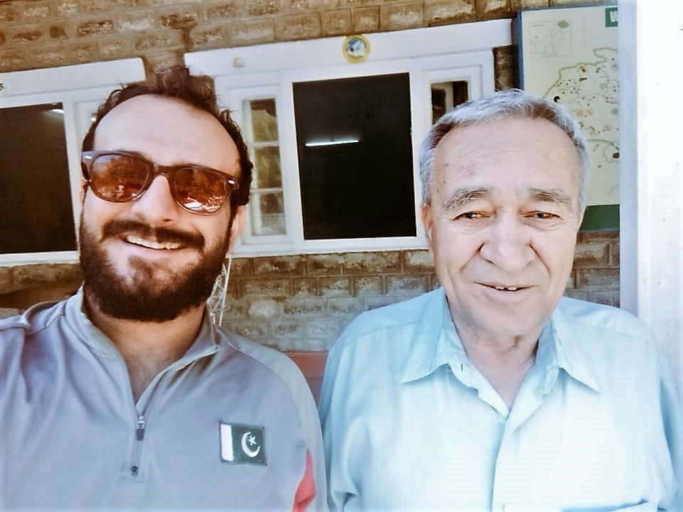 Ashraf Aman poses for a selfie with a person.